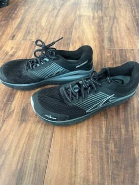Altra Black Running Shoes with Teal Accent Stripes